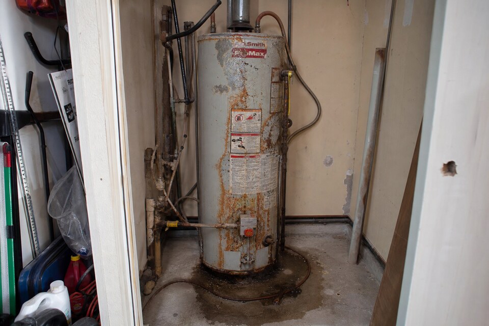 Before — failing tank water heater